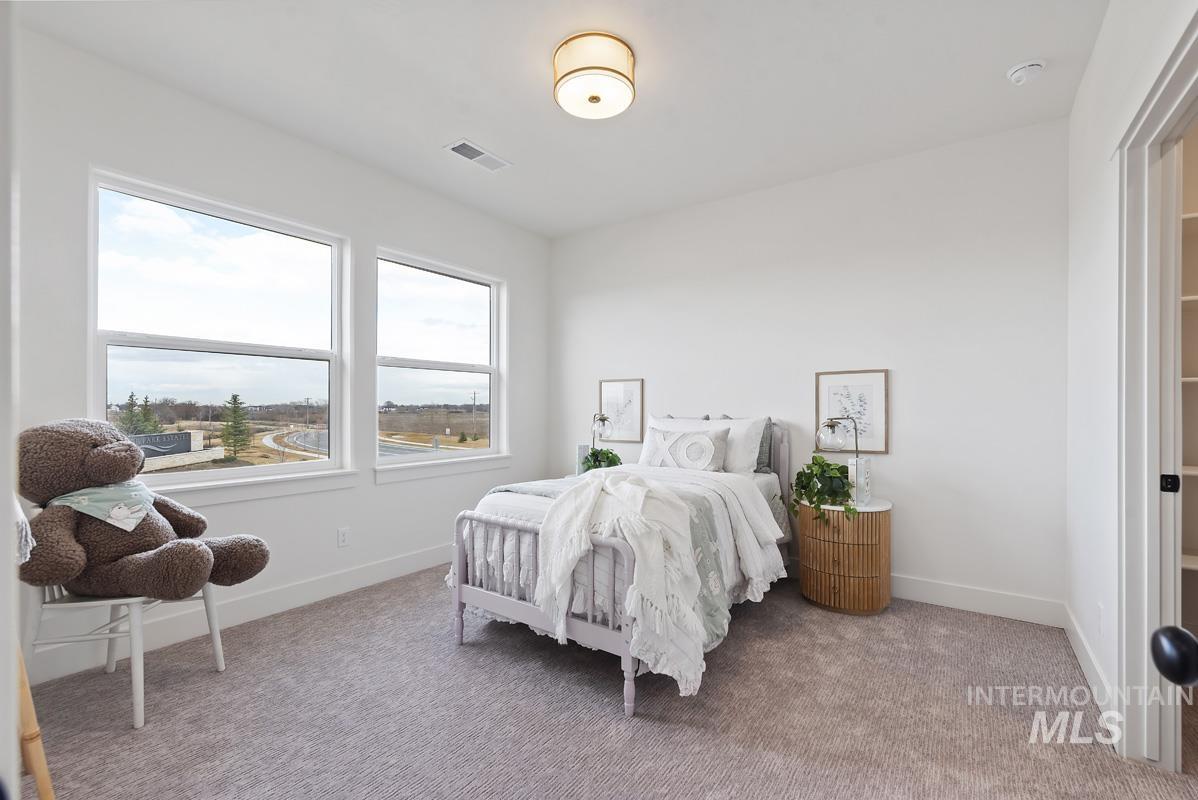 Bedroom featuring carpet flooring