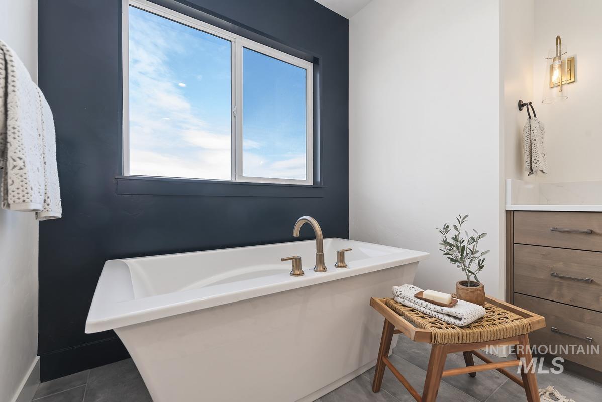 Full bathroom with a soaking tub