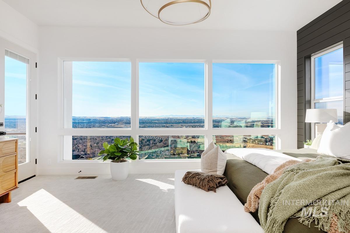 Carpeted bedroom featuring access to outside