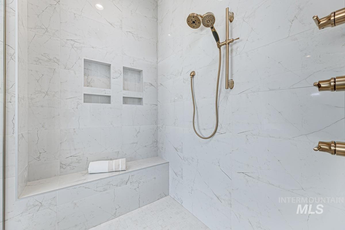 Full bathroom featuring a marble finish shower
