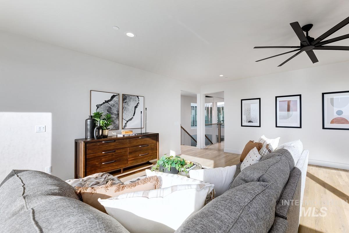 Living room featuring recessed lighting, wood finished floors, and ceiling fan