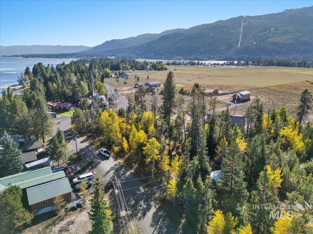 Aerial overview of property's location featuring a water and mountain view