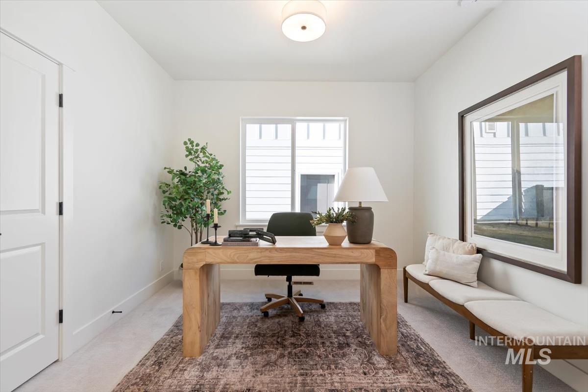 Office featuring baseboards and carpet floors