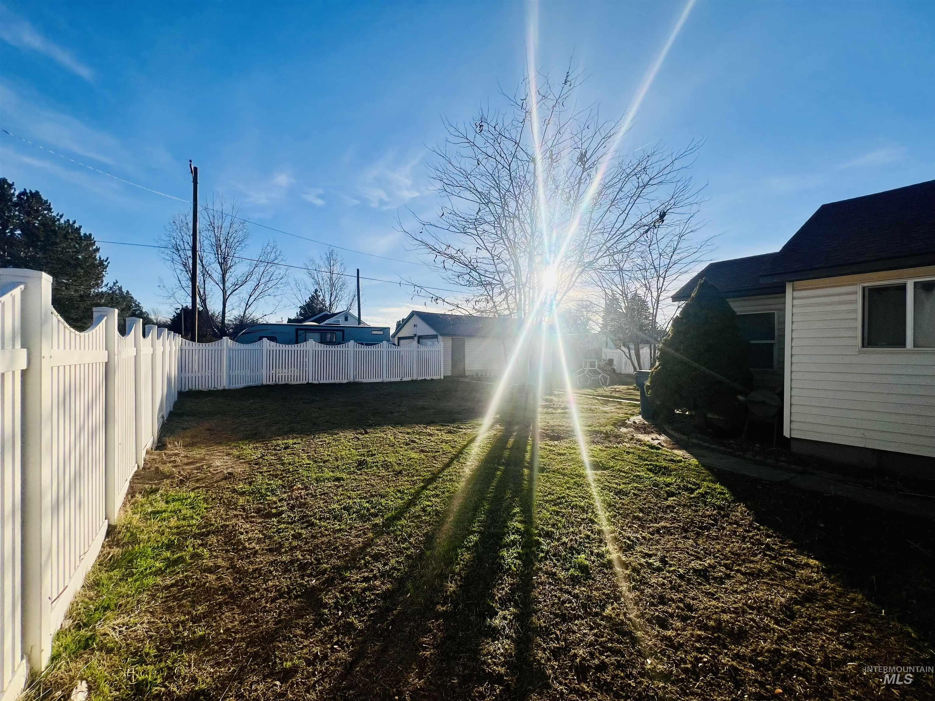 View of fenced backyard