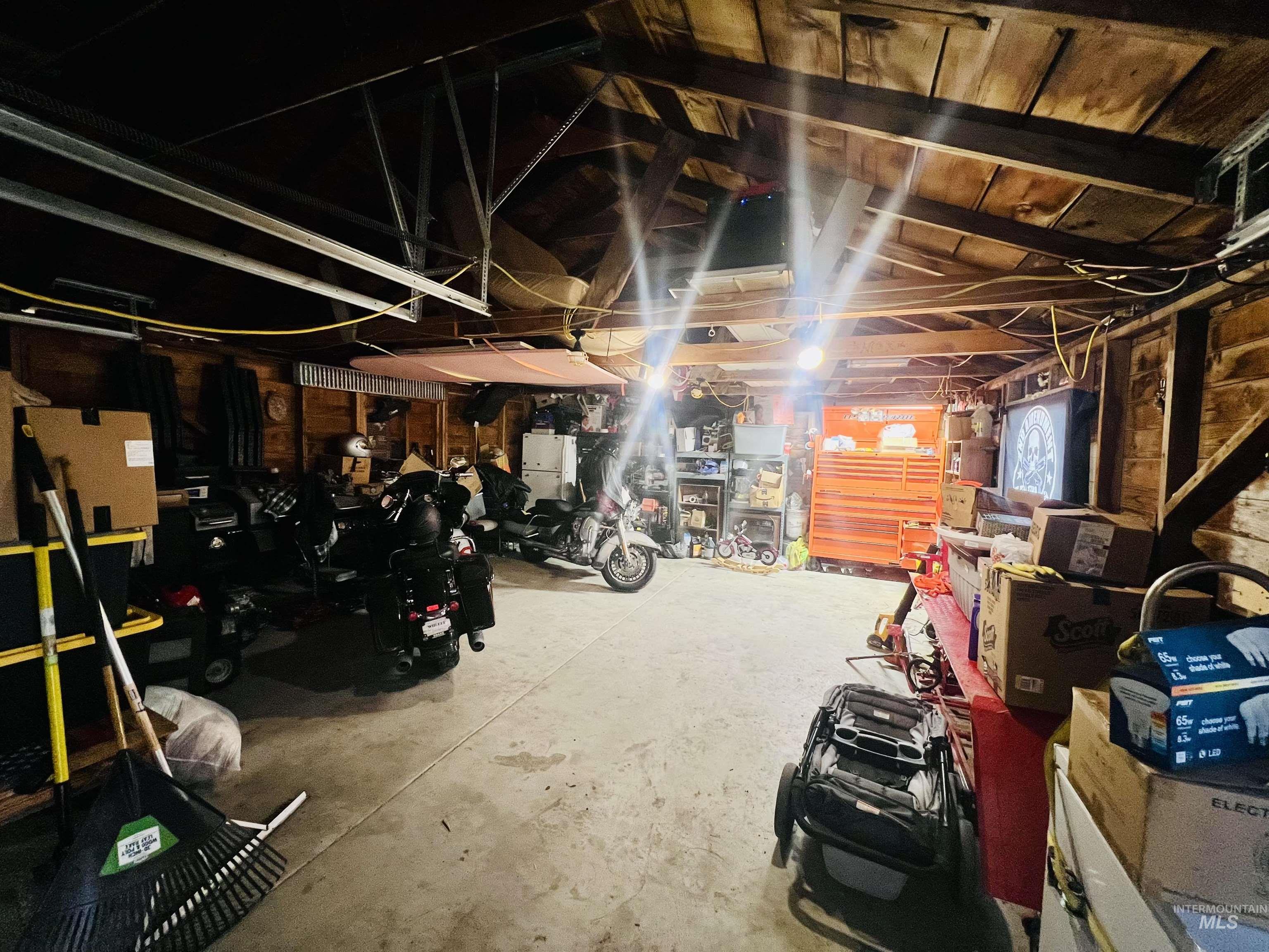 Basement featuring freestanding refrigerator