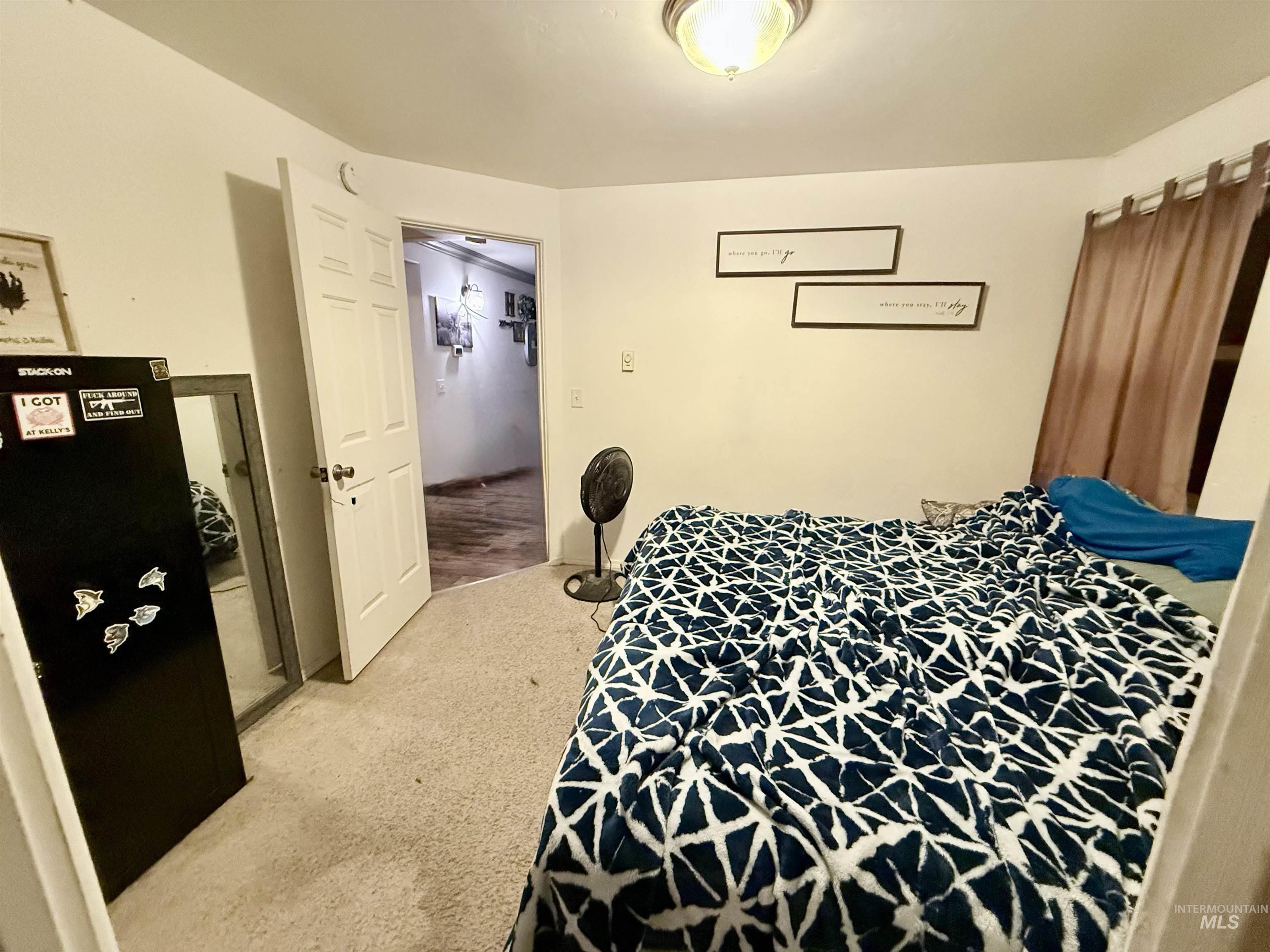 Bedroom with light carpet