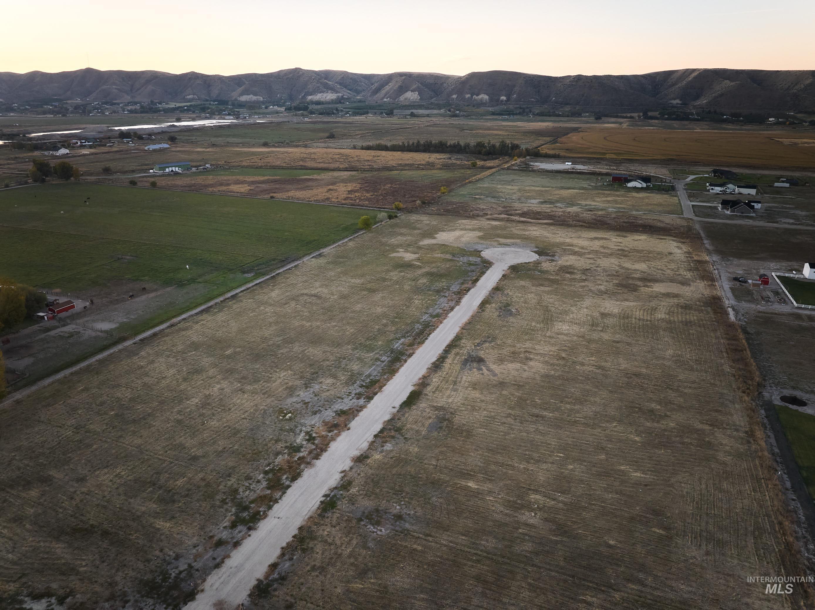 View of property location featuring rural landscape and a mountain backdrop