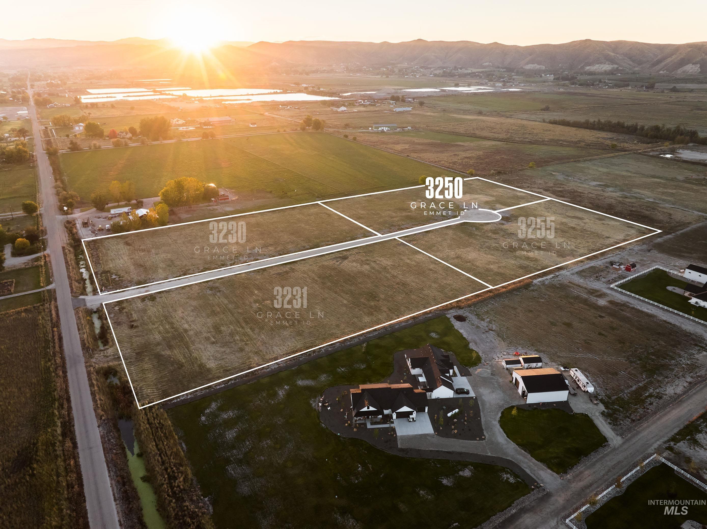 Aerial view at dusk of a mountain view, a view of countryside, and property parcel outlined