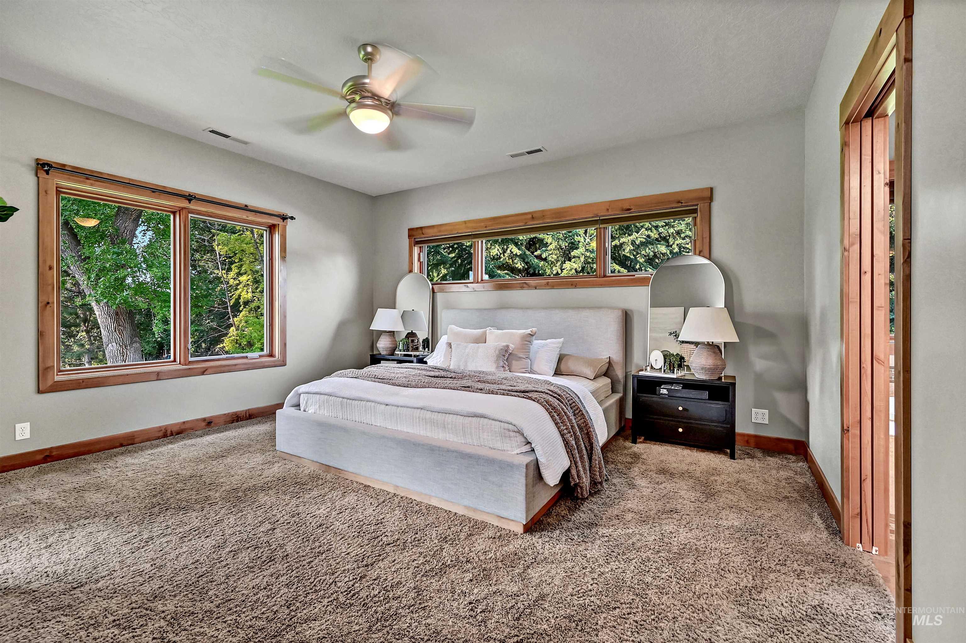 Bedroom featuring carpet floors and a ceiling fan