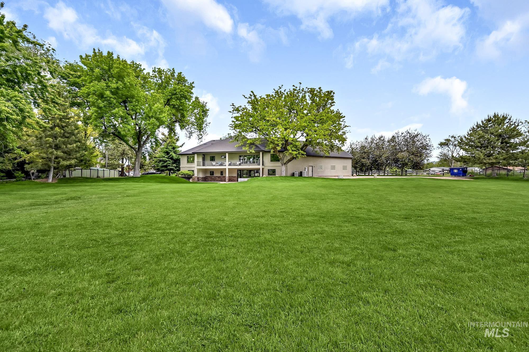 View of yard featuring a balcony