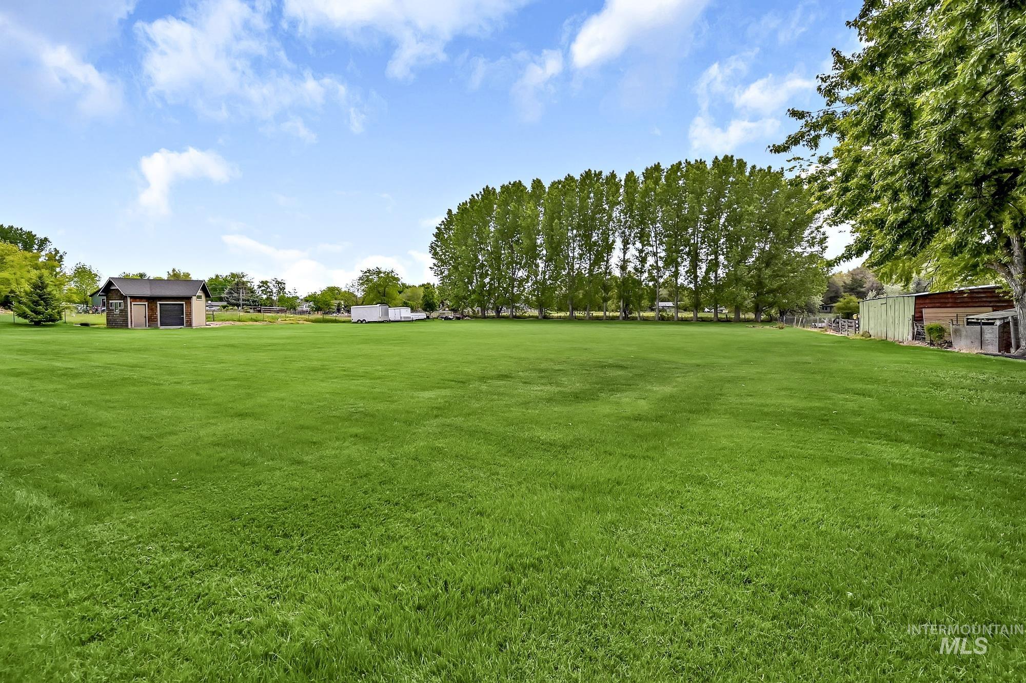 View of green lawn with an outdoor structure