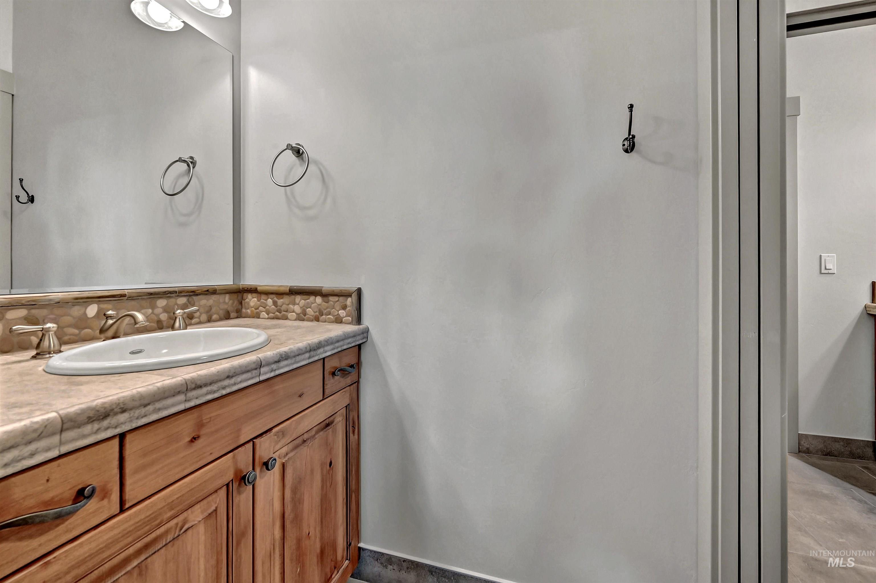 Bathroom featuring vanity and baseboards