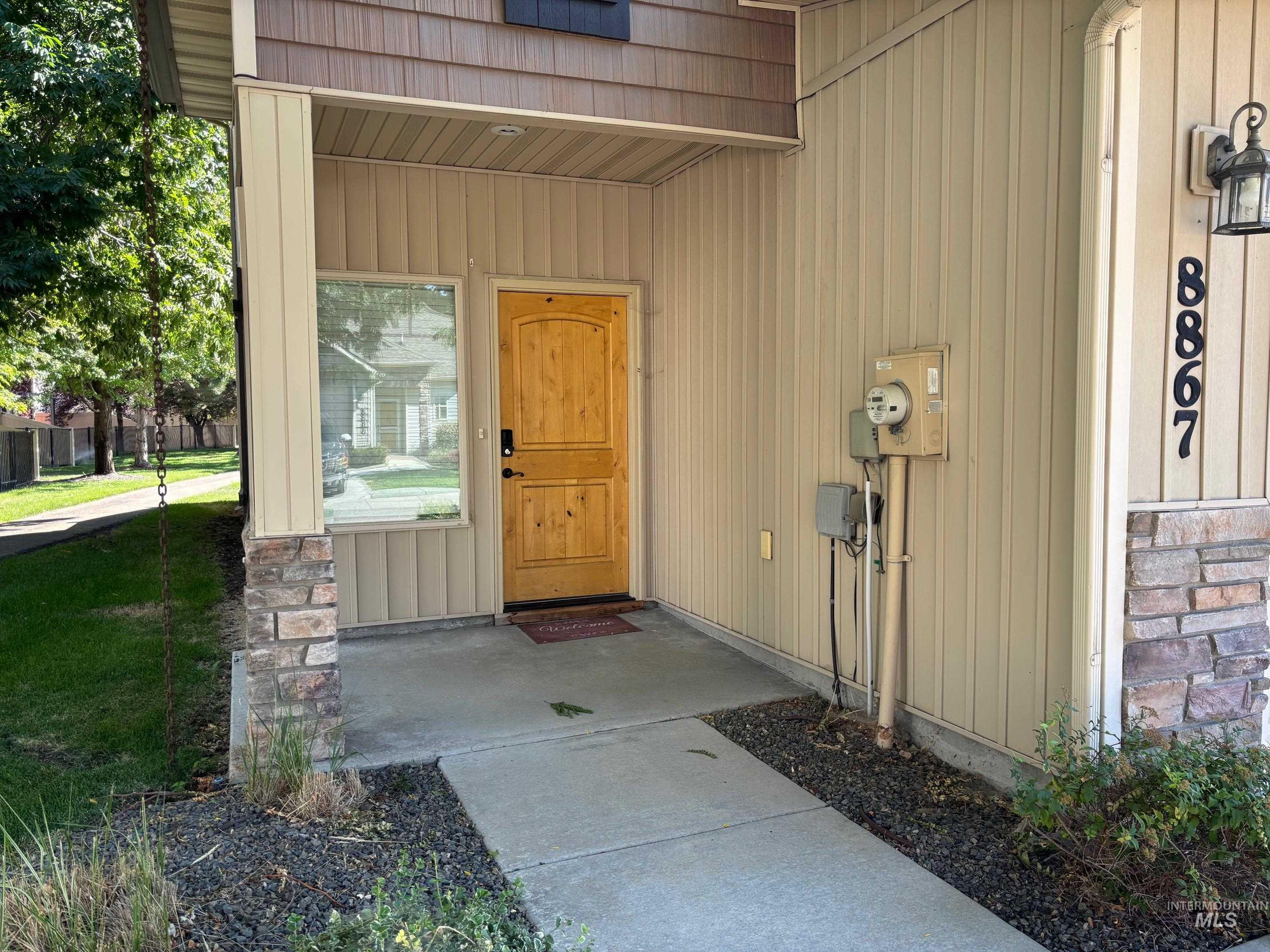 Entrance to property featuring board and batten siding