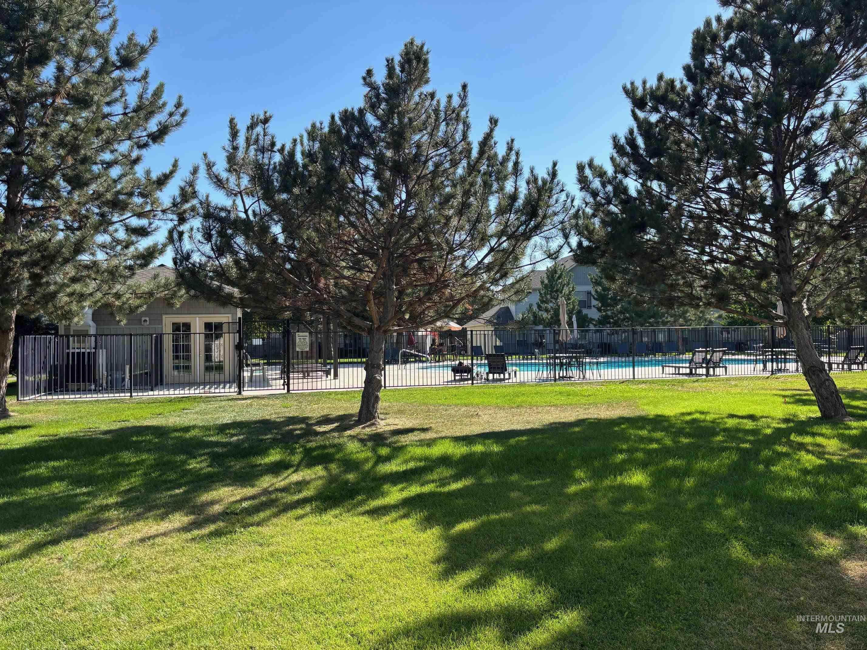 View of yard featuring a community pool