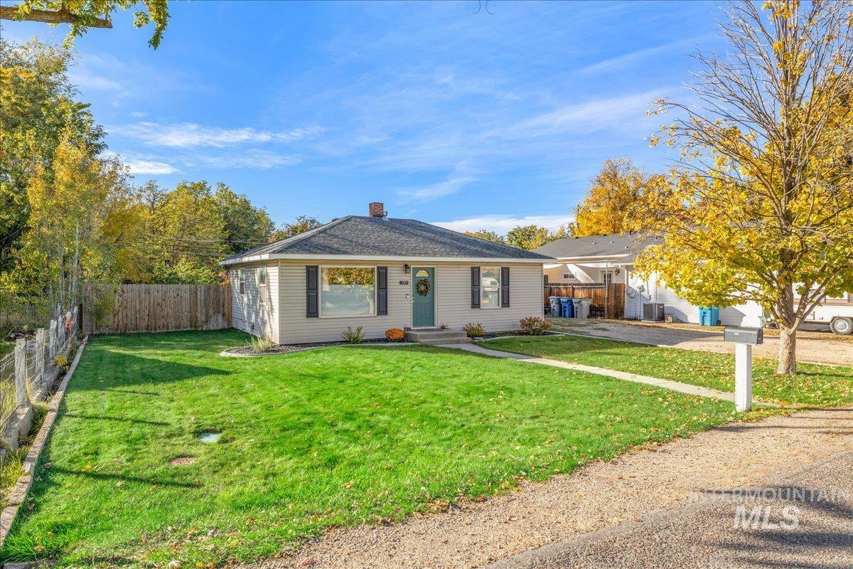 Bungalow-style home featuring a chimney