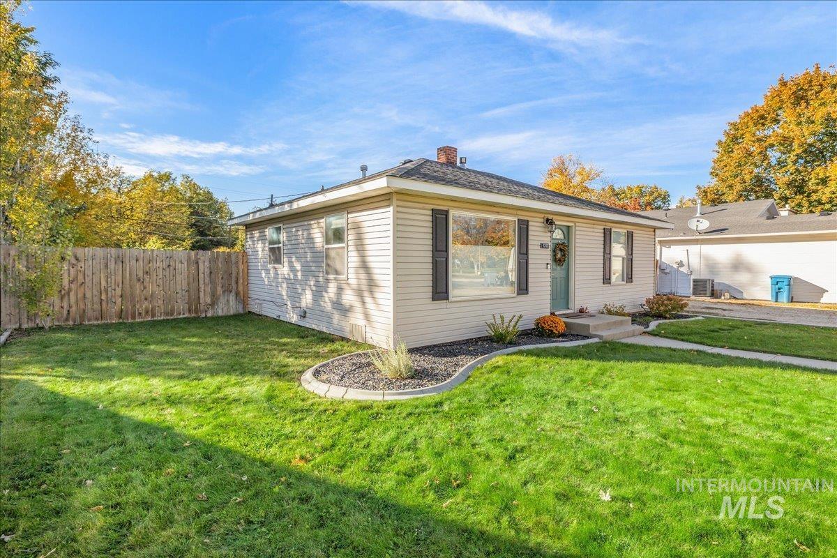 Bungalow-style home with a chimney