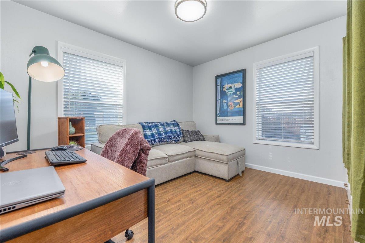 Home office featuring wood finished floors and plenty of natural light