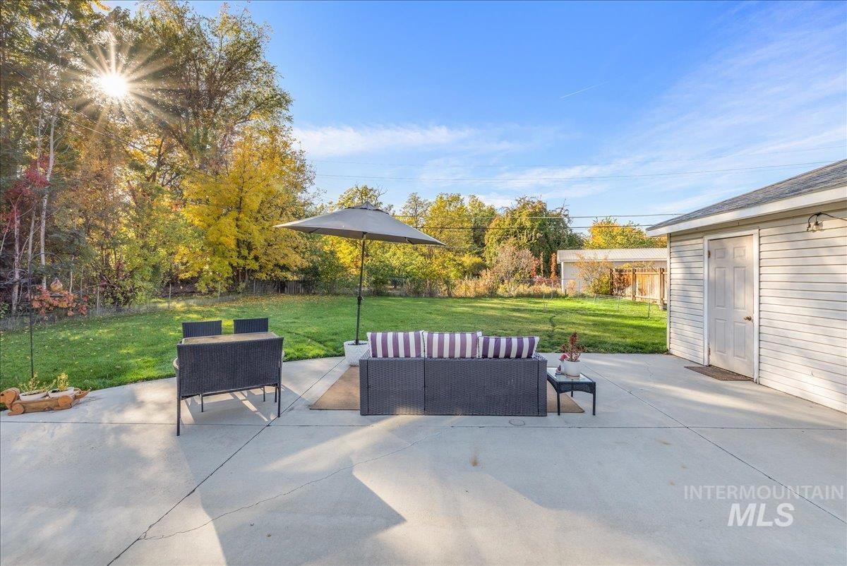View of patio with an outdoor hangout area