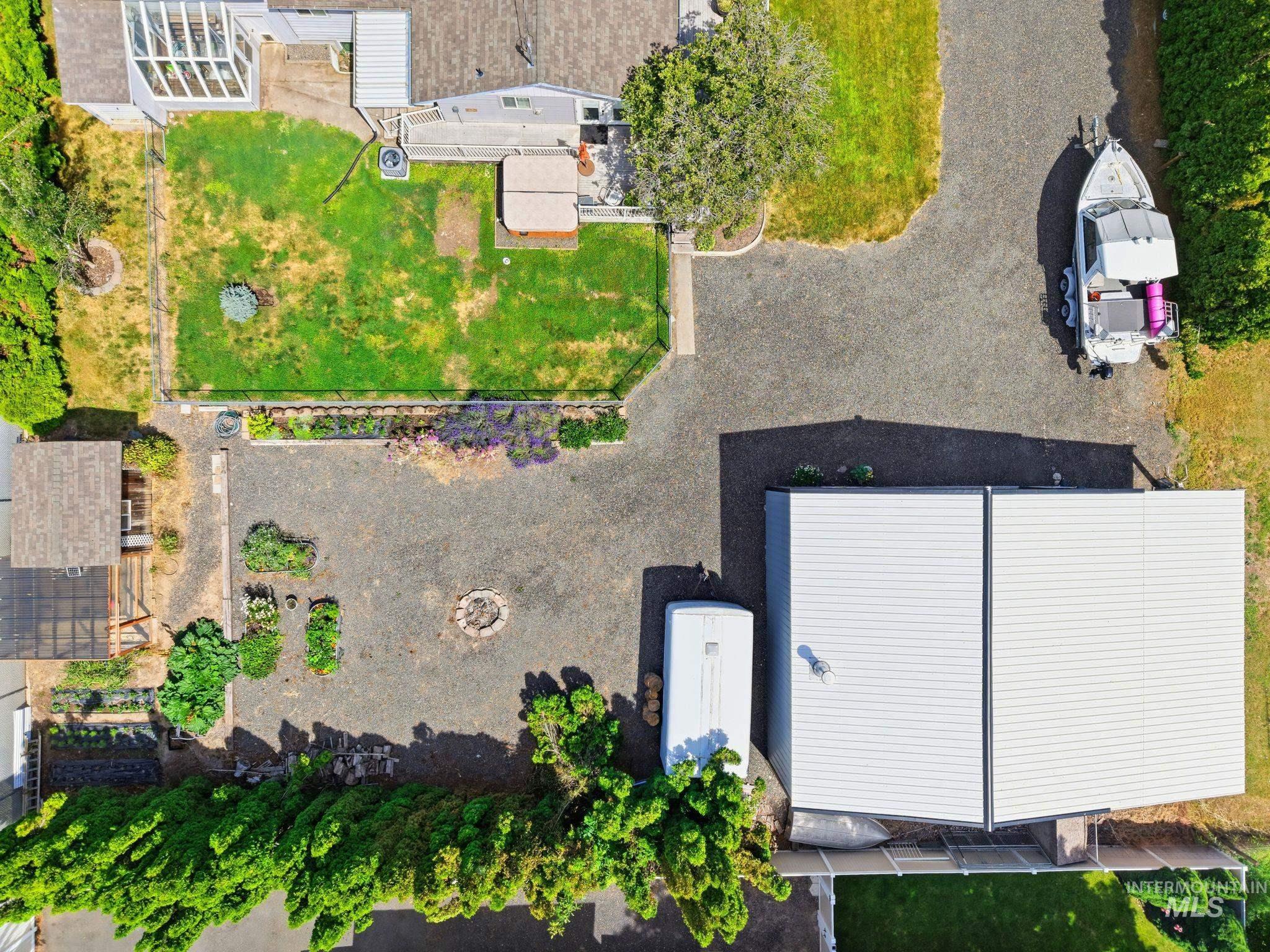 Expansive gravel driveway with ample parking