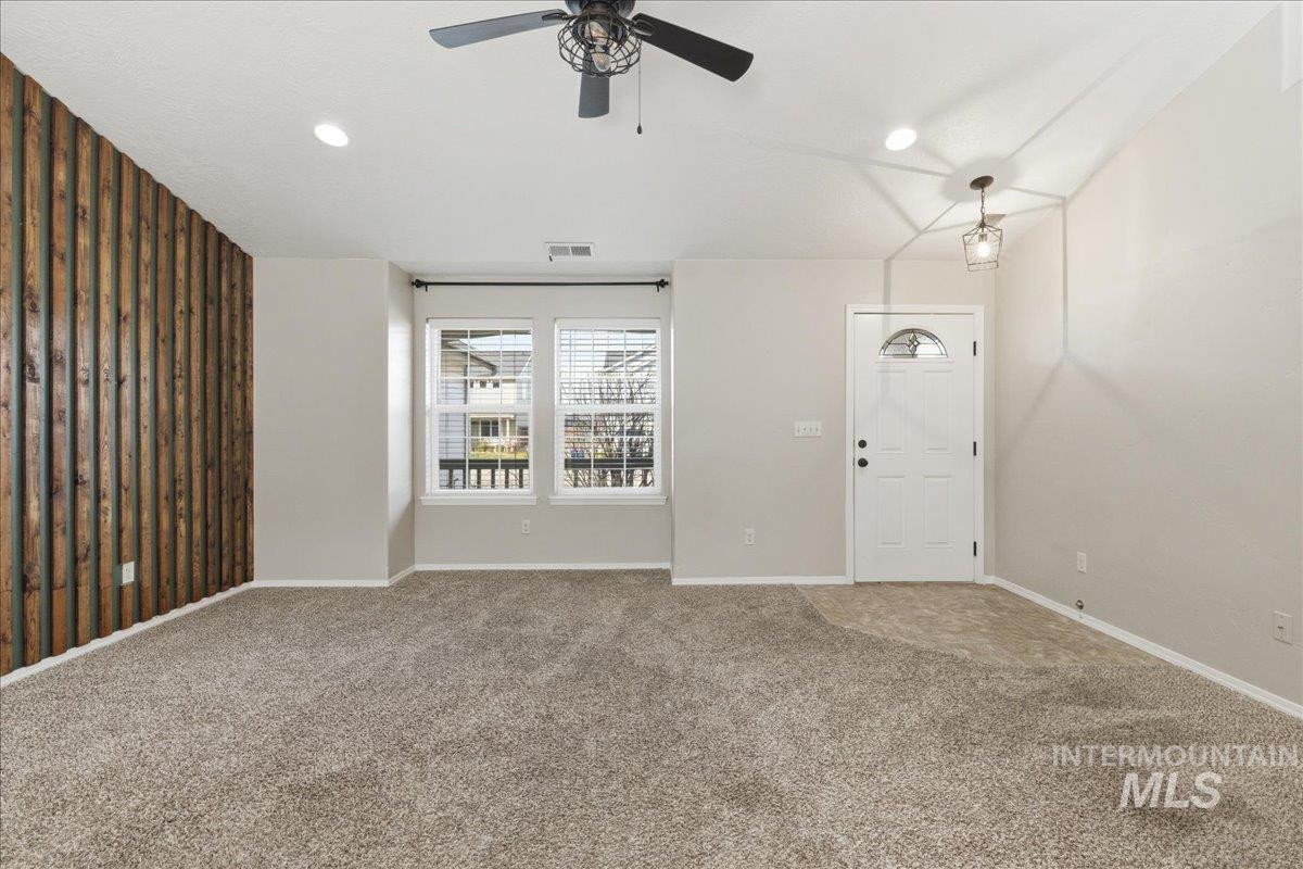 Unfurnished living room with ceiling fan, carpet, and recessed lighting