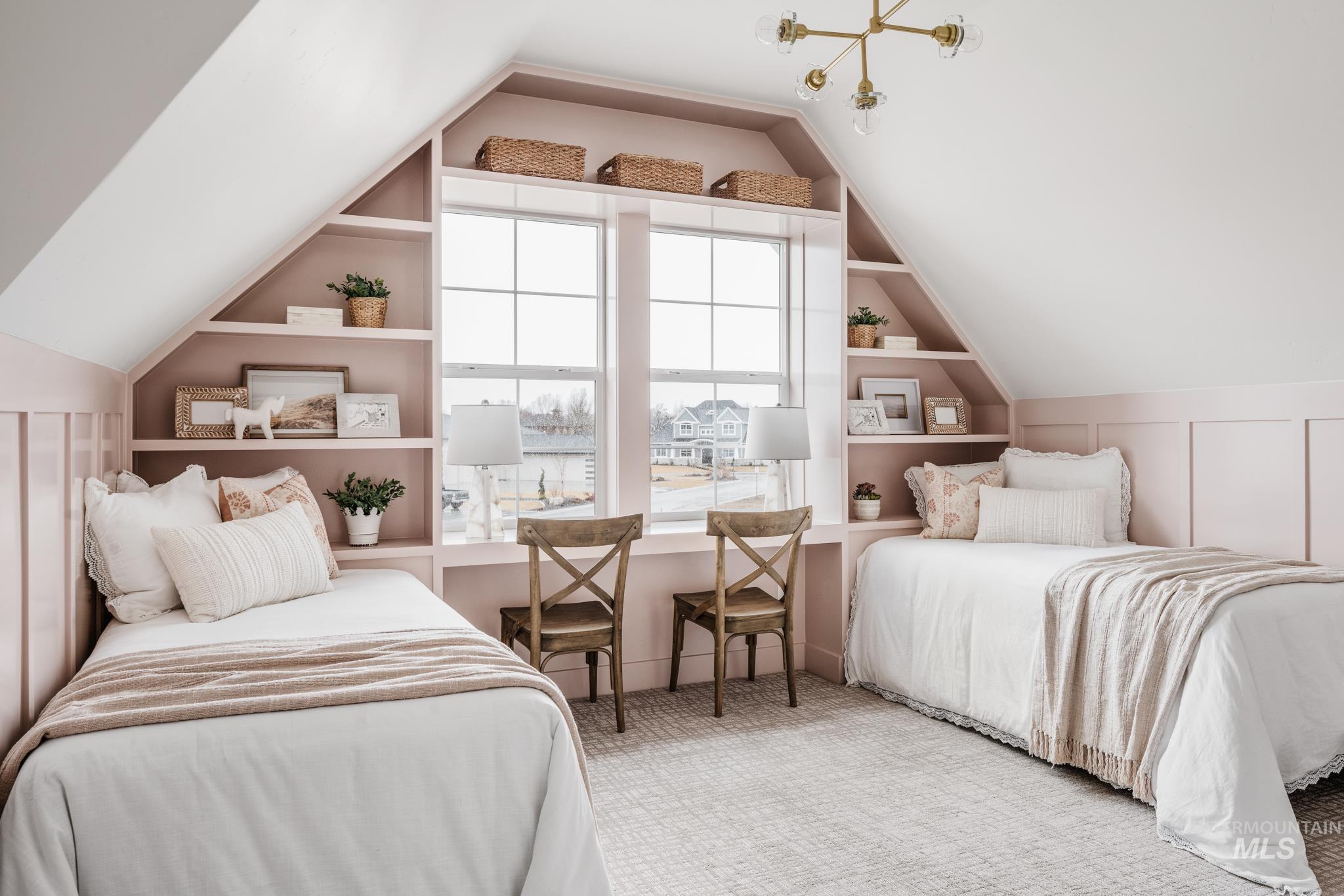Bedroom with vaulted ceiling and carpet