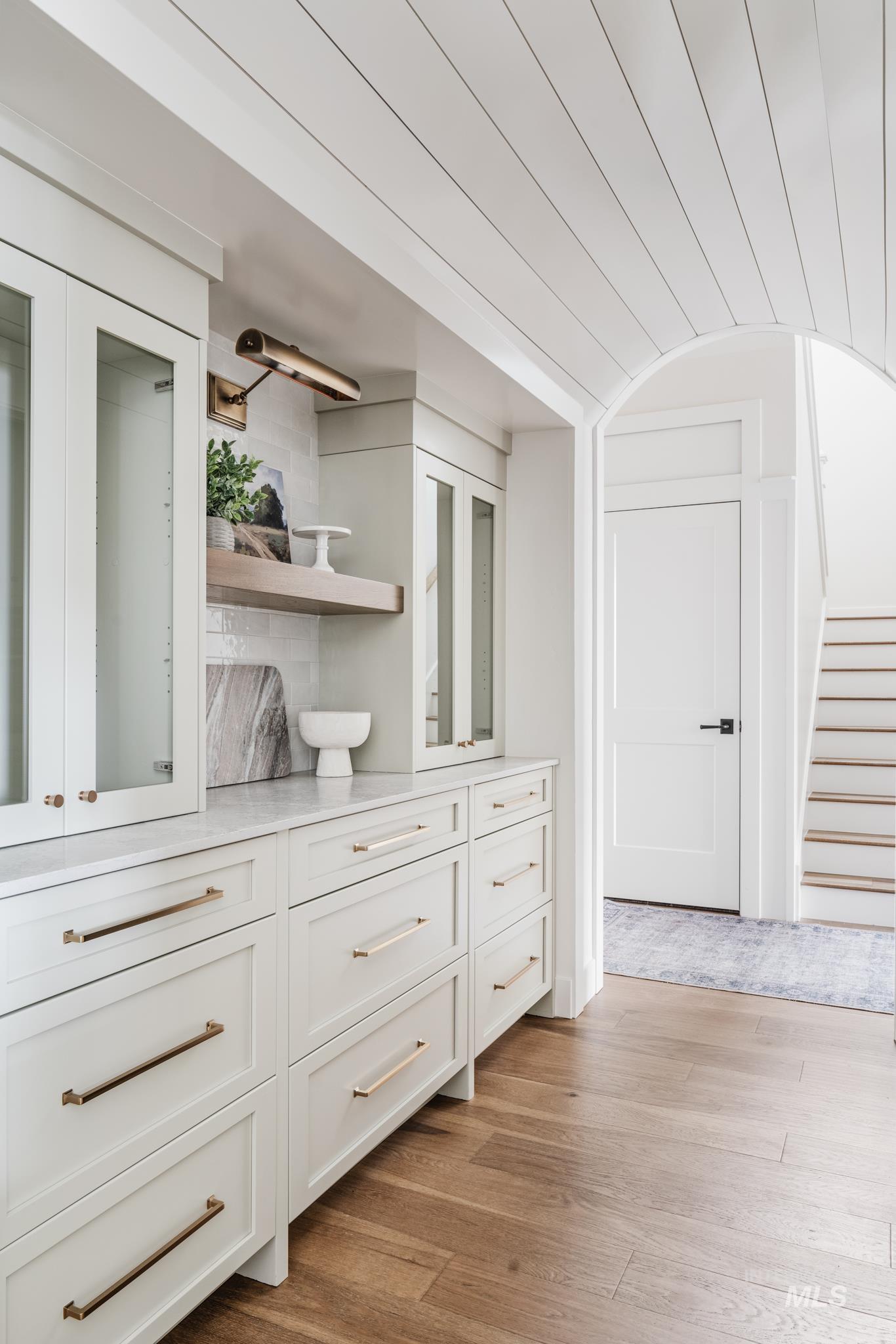 Detailed view of wood finished floors and backsplash