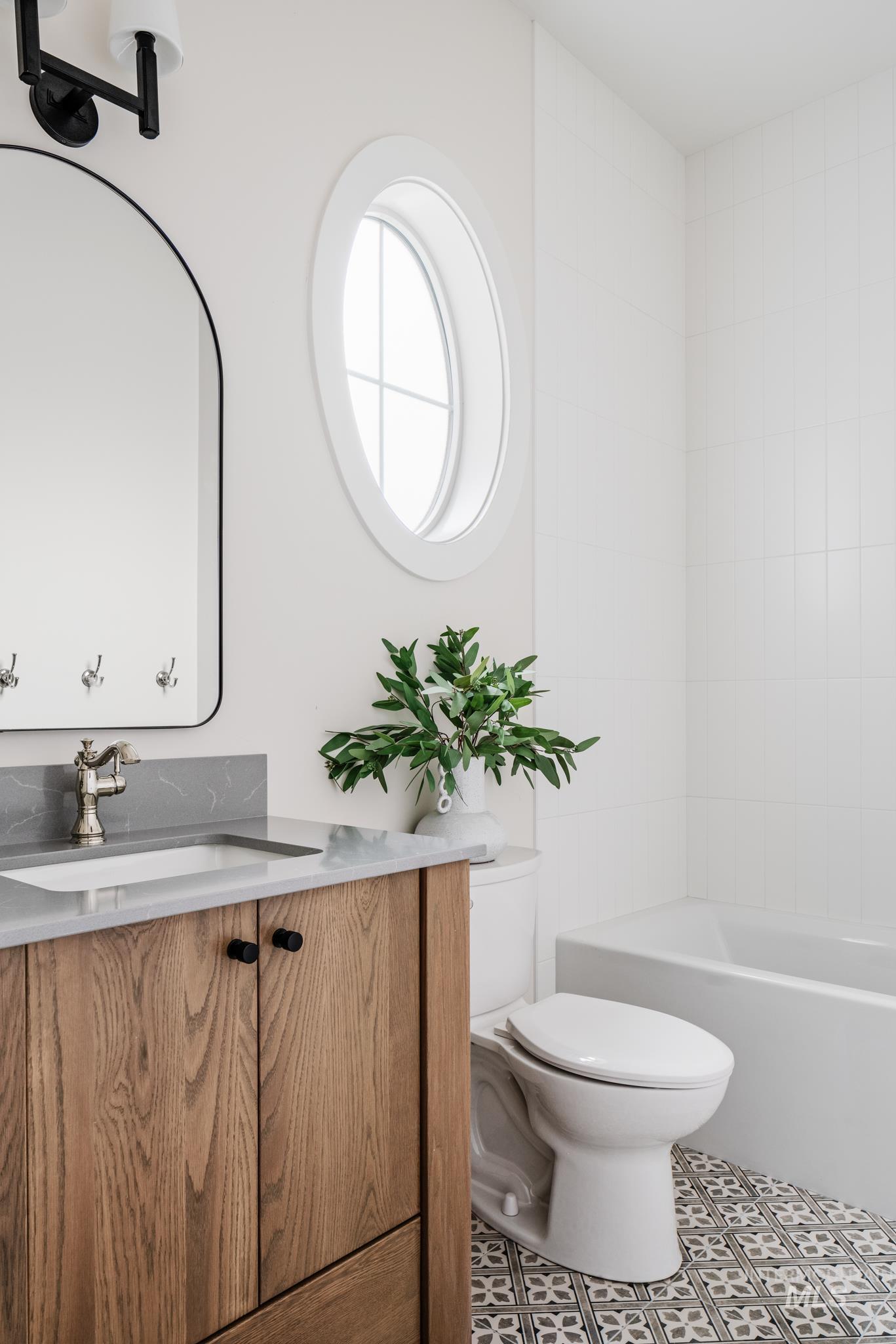 Full bathroom with vanity, tile patterned floors, and shower / bathtub combination