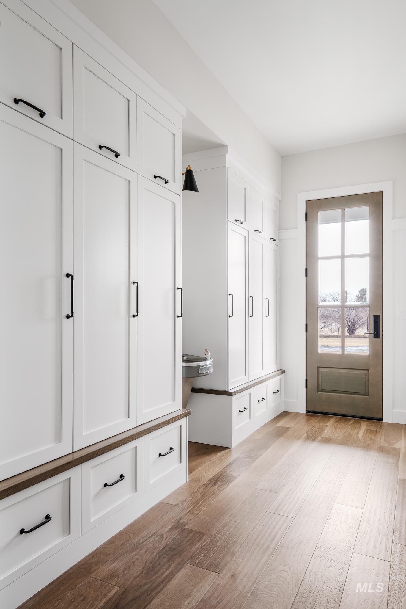 Mudroom featuring light wood-type flooring