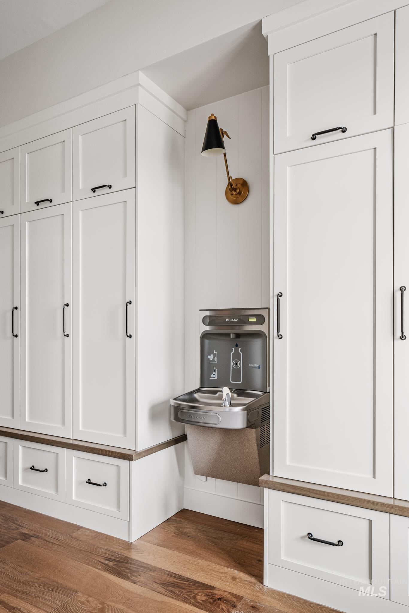 Mudroom featuring dark wood-style floors