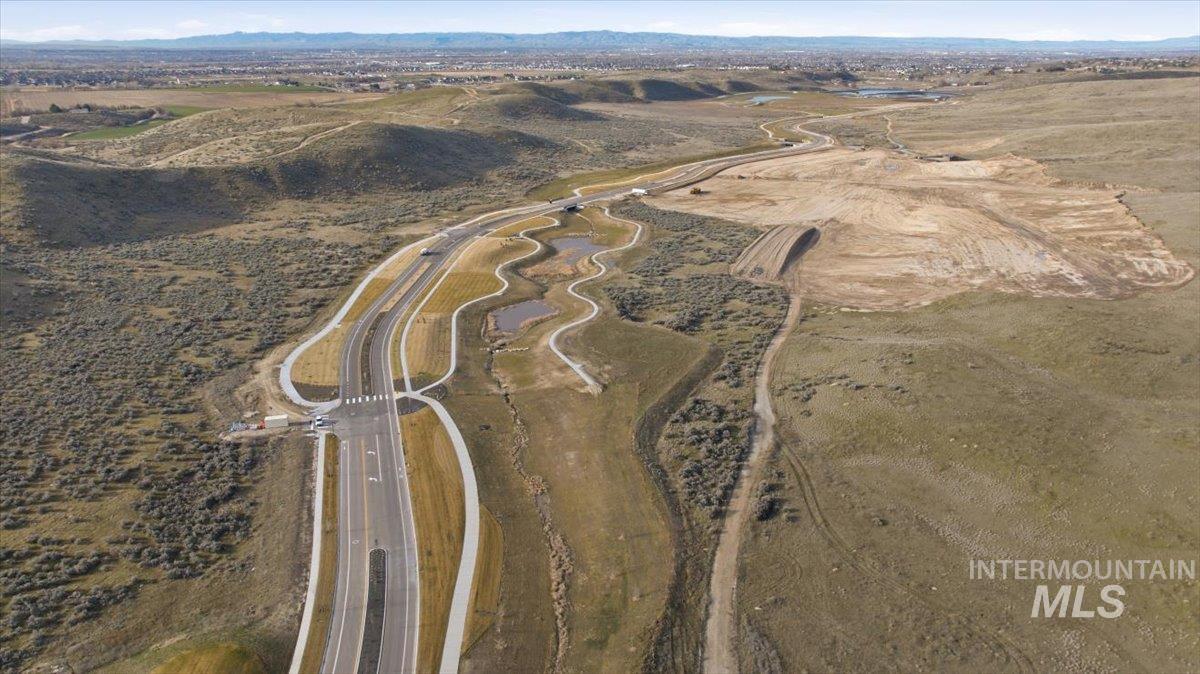 Aerial overview of property's location with mountains and rural landscape