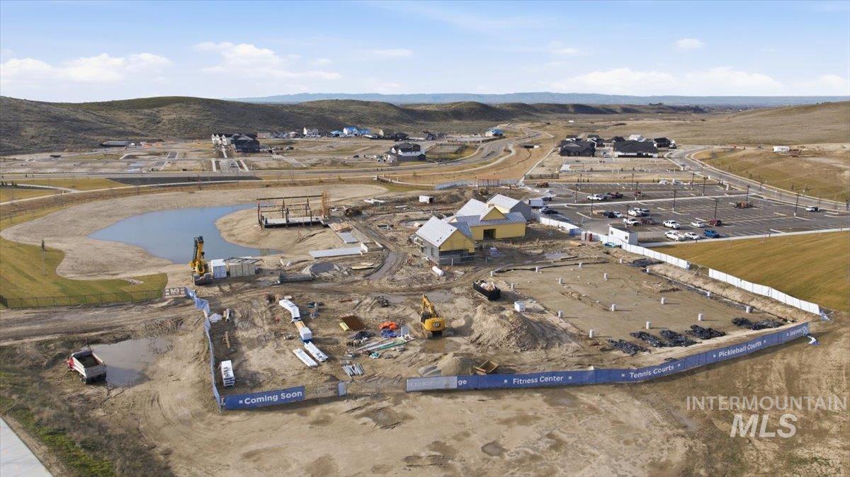 Aerial view of property's location with a water and mountain view