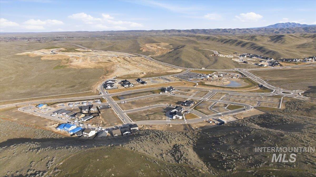 Aerial view of property's location featuring mountains