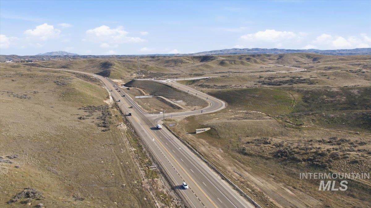 Aerial view of sparsely populated area with a mountain backdrop