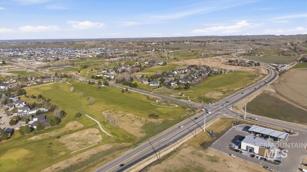 Aerial overview of property's location featuring nearby suburban area