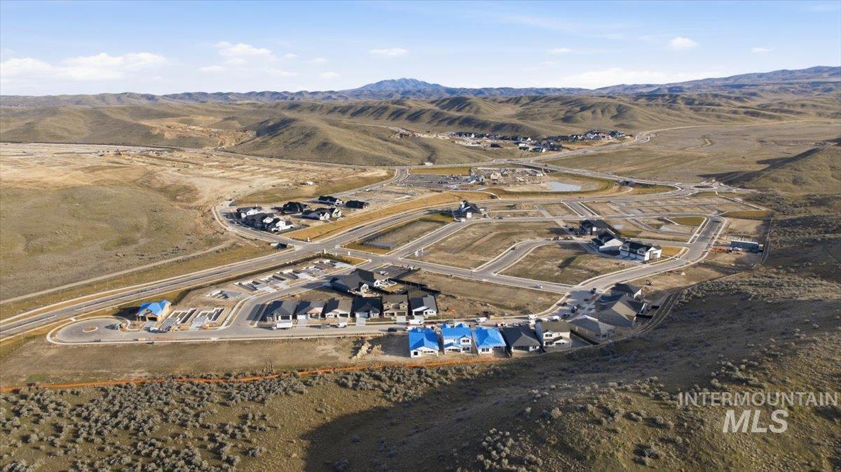 View of property location featuring a mountainous background and rural landscape