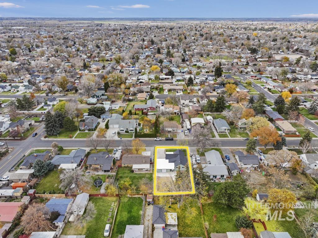 Aerial view of residential area with property boundaries highlighted