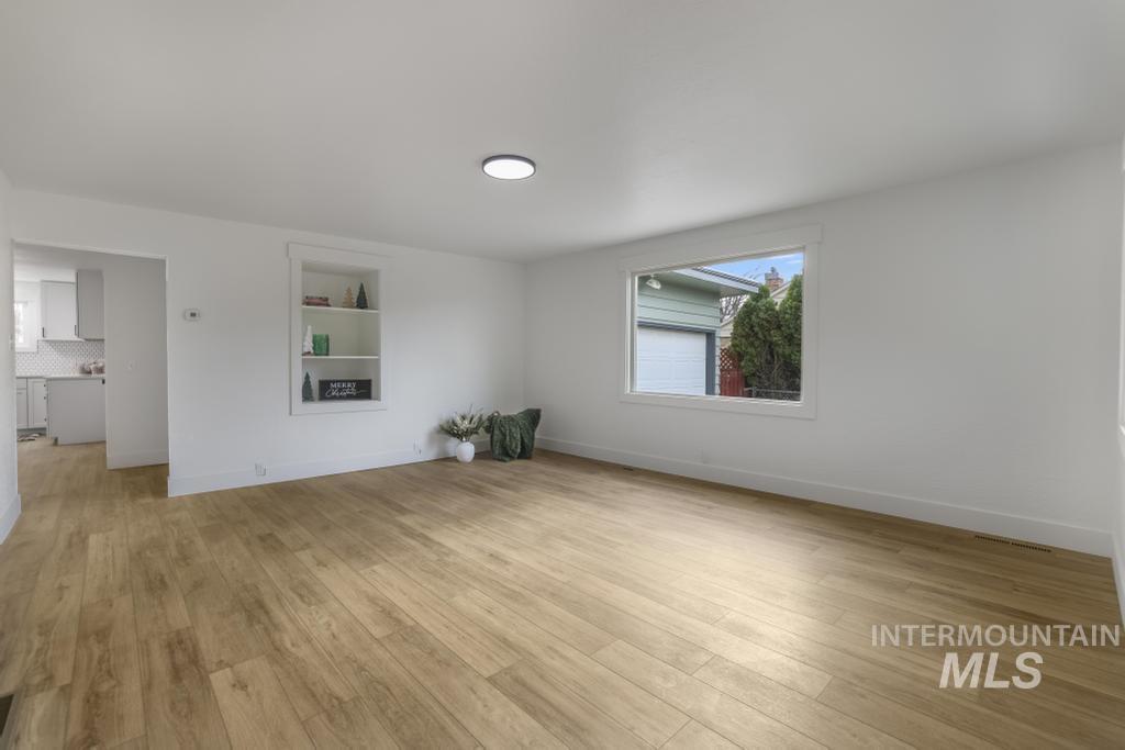 Empty room featuring light wood-style floors