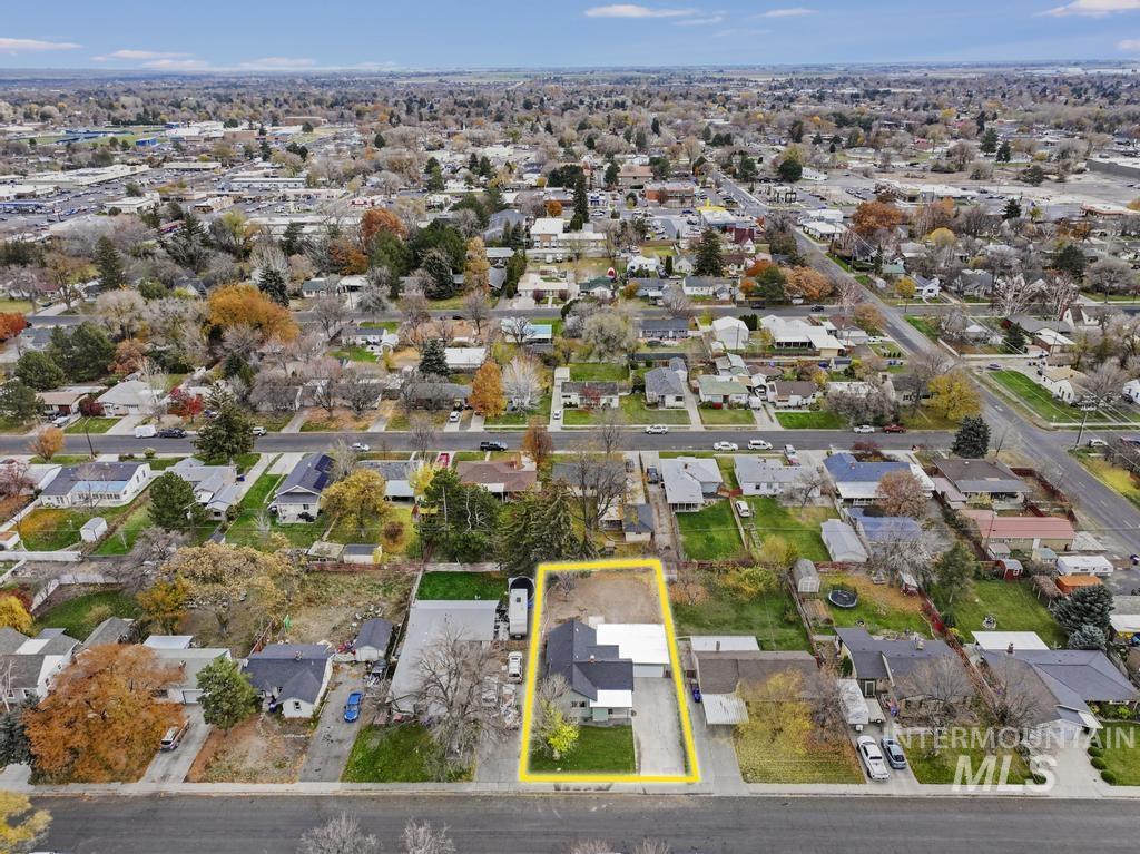 Aerial perspective of suburban area featuring property boundaries highlighted