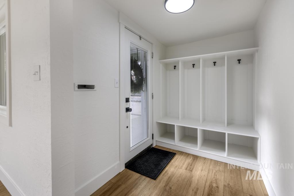 Mudroom with light wood-style flooring