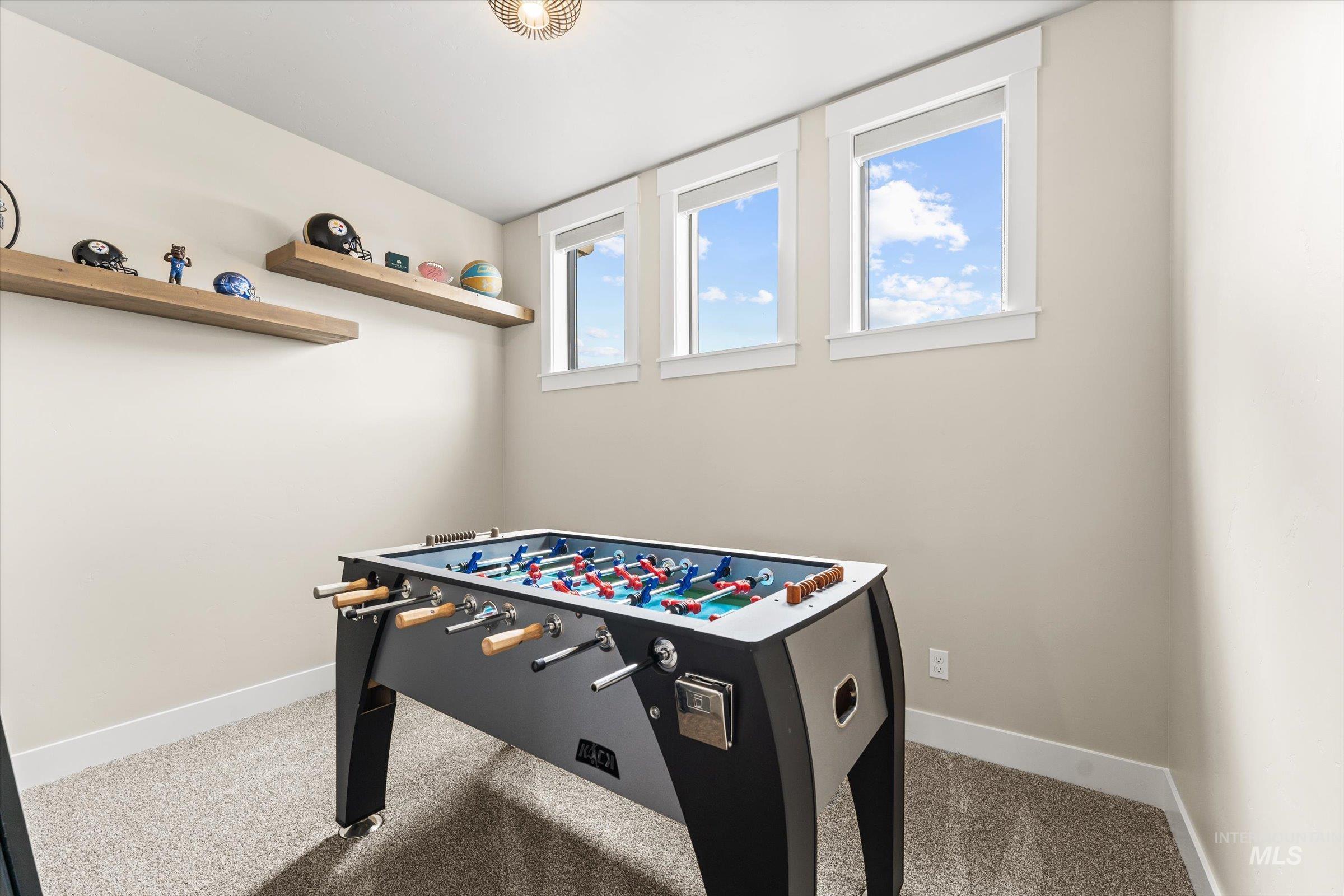 Playroom featuring light carpet and baseboards