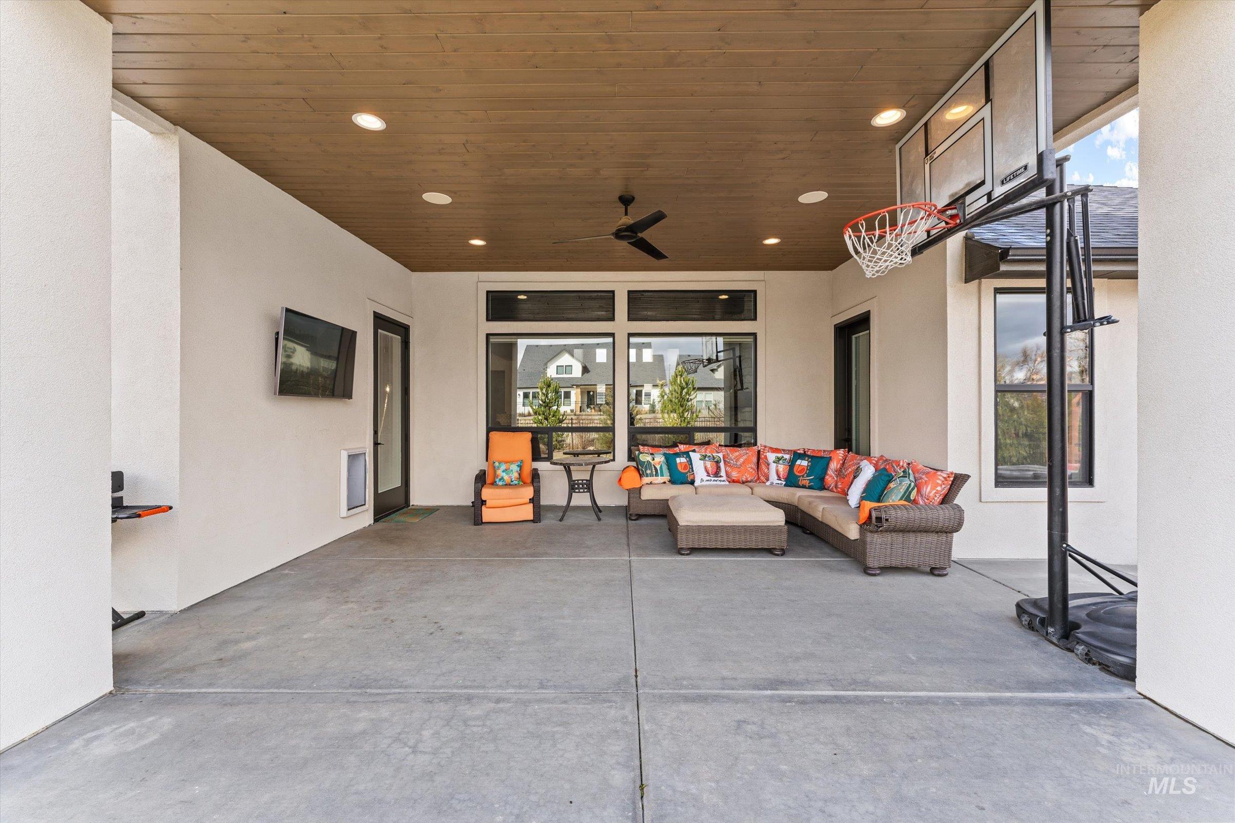 View of patio with a ceiling fan and outdoor furniture