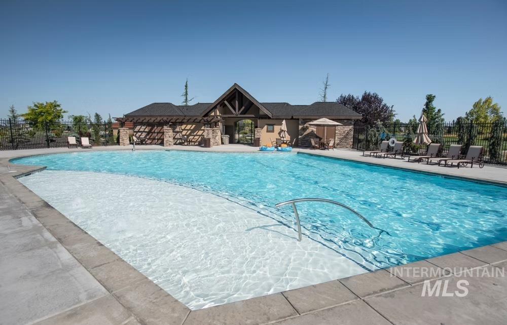 Community pool with a patio area