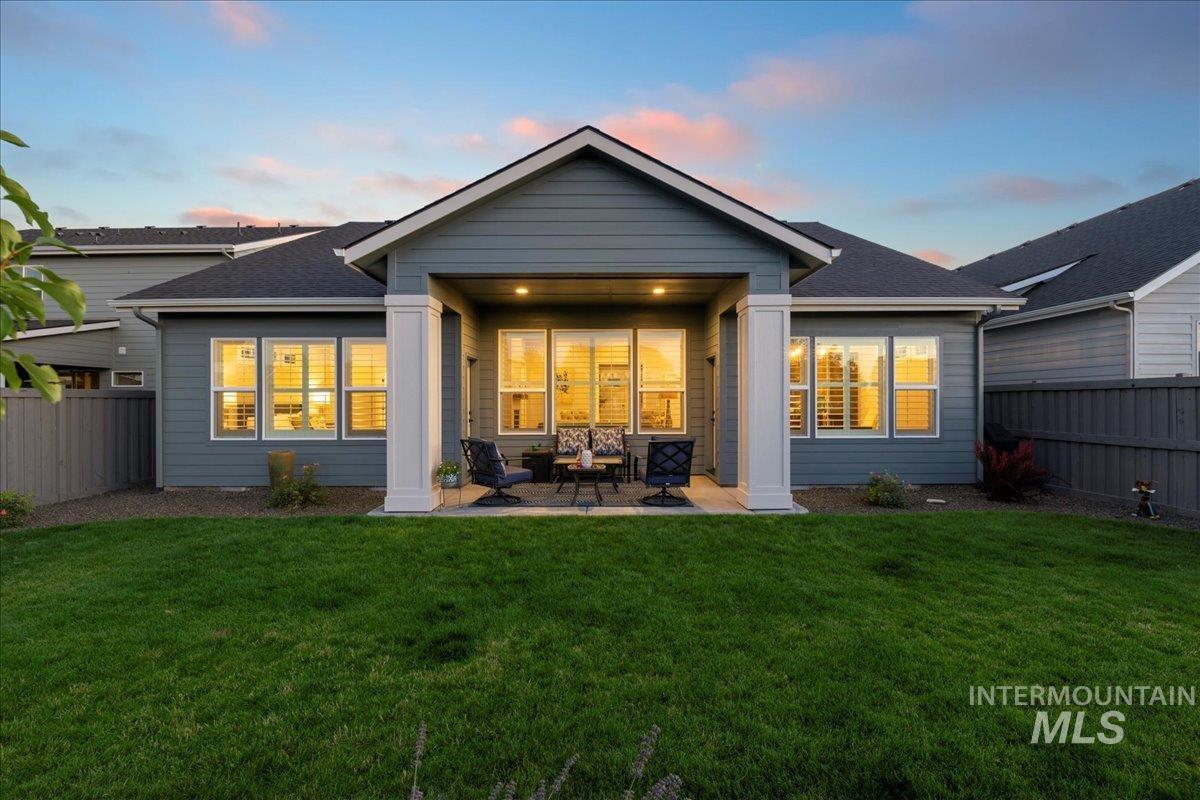 Rear view of property featuring a patio area