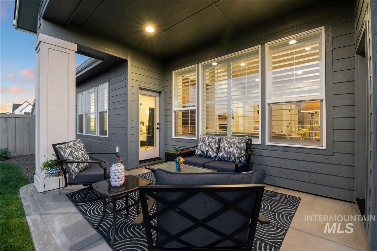 View of patio with an outdoor hangout area