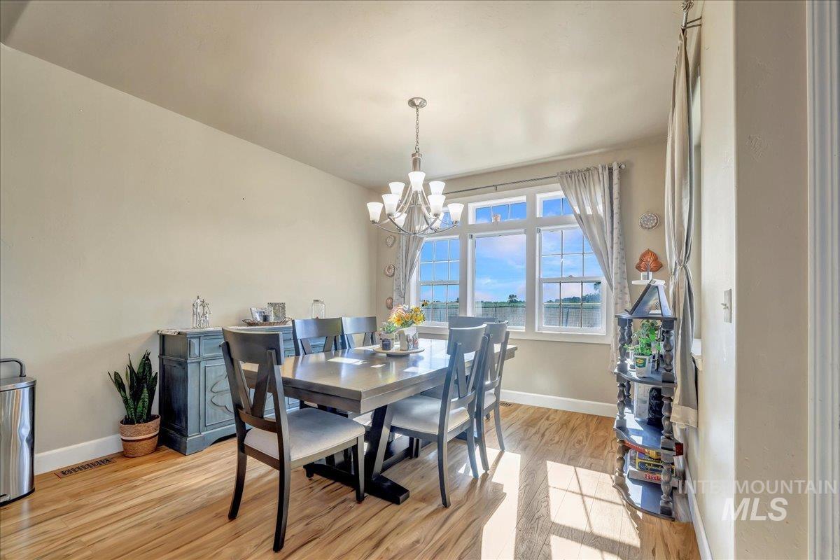 Dining room featuring a chandelier and light wood finished floors