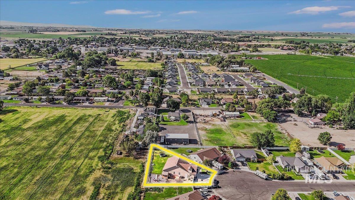 Aerial perspective of suburban area featuring property parcel outlined