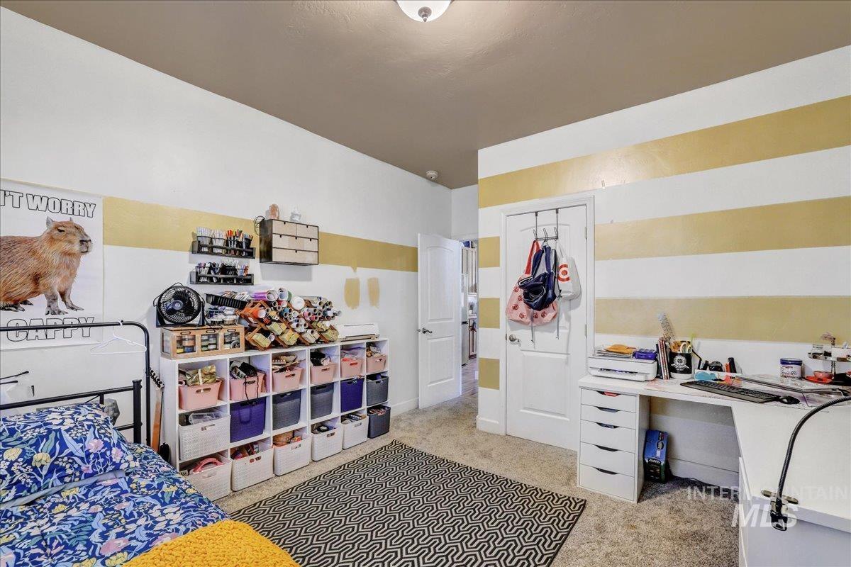 Bedroom with light carpet