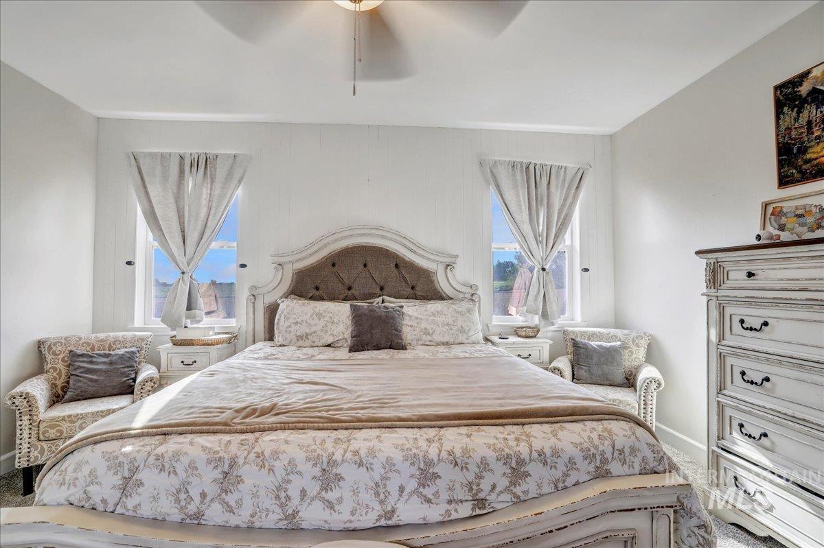 Bedroom featuring baseboards and a ceiling fan