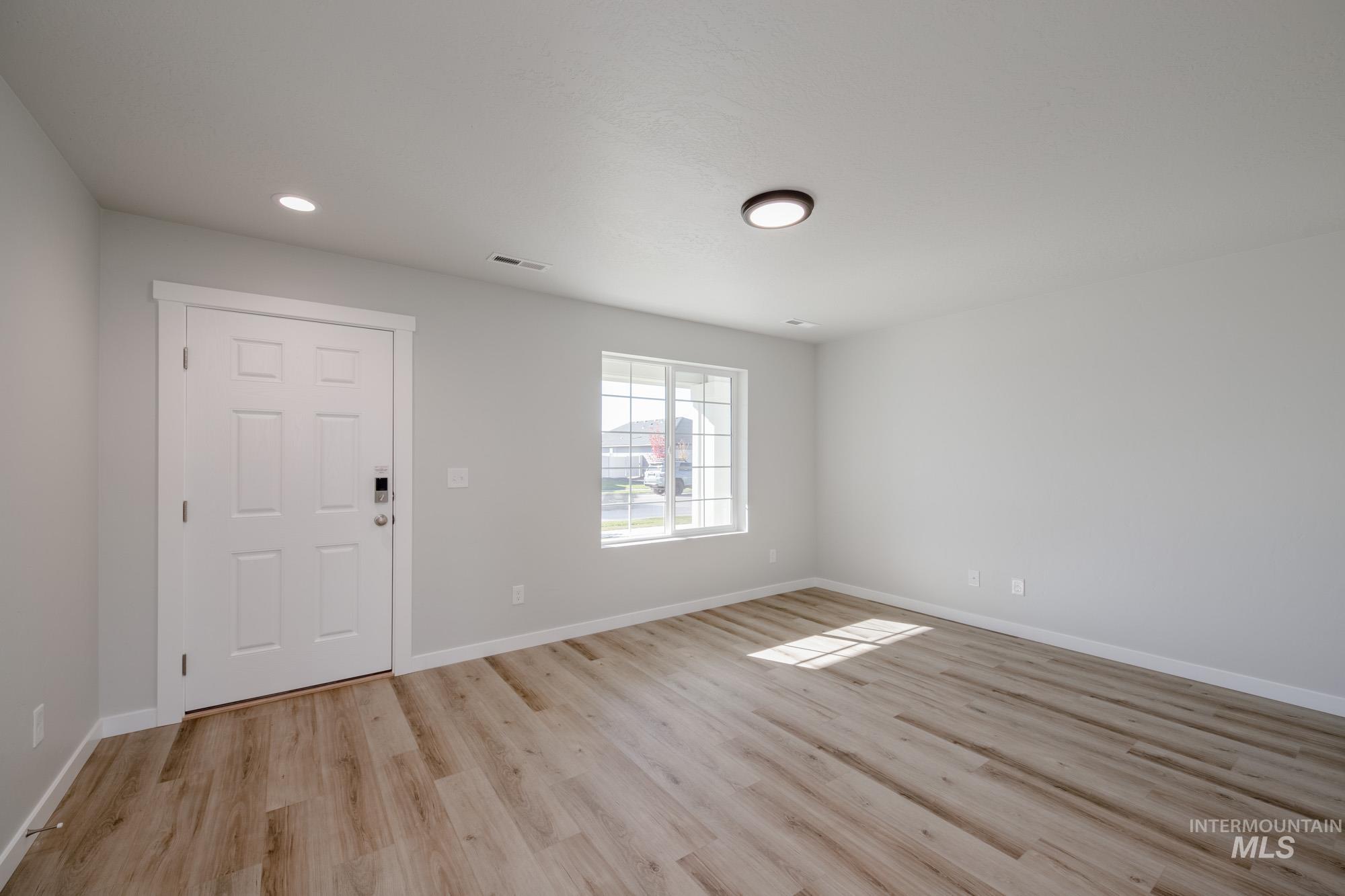 Foyer entrance featuring light wood-type flooring and recessed lighting