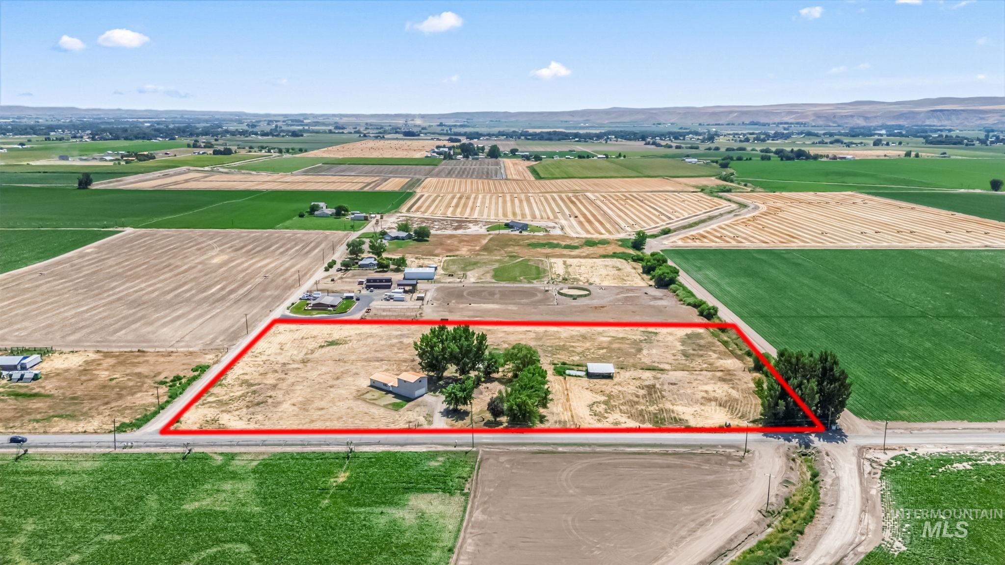 Overview of rural landscape with extensive farmland and property parcel outlined